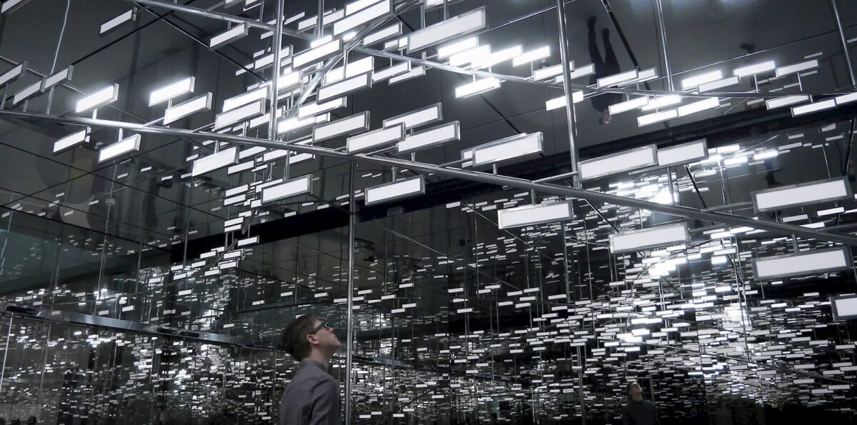 Man looks at OLED lighting installation Light Cloud