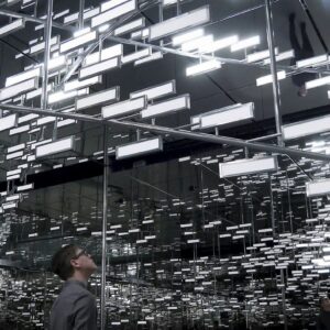 Man looks at OLED lighting installation Light Cloud